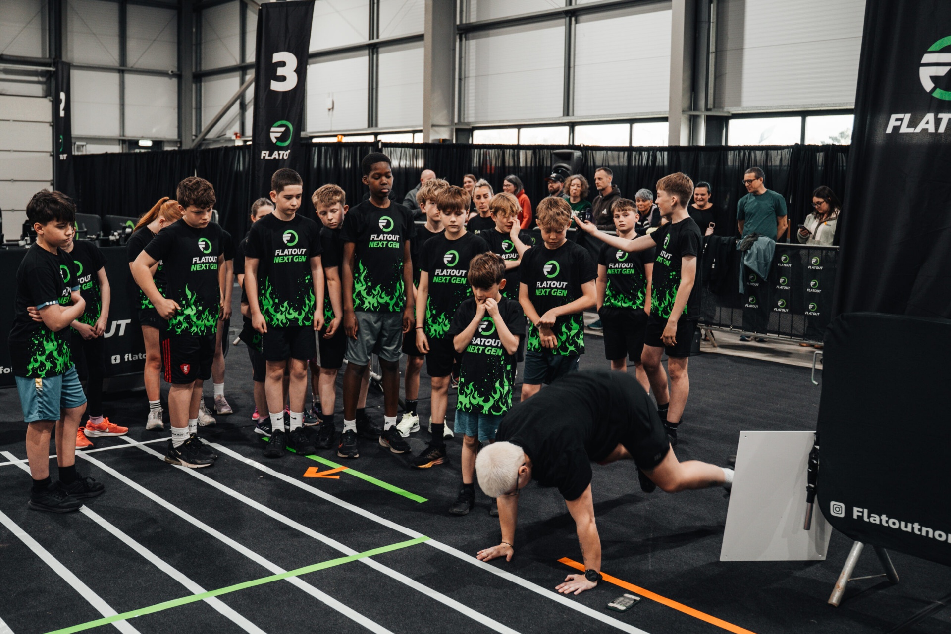 NextGen athletes lined up on the race floor