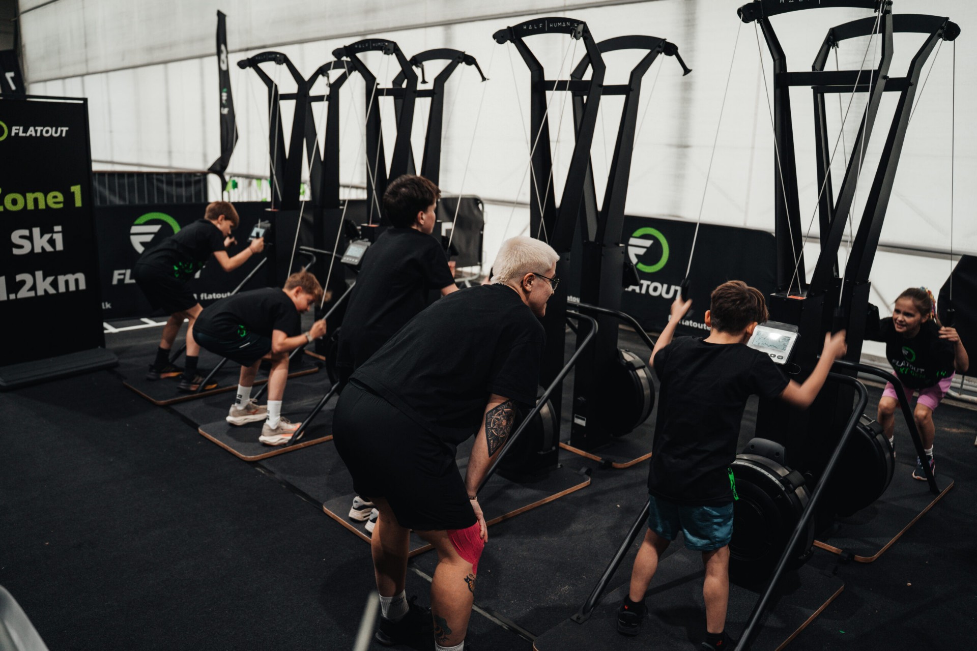 Young athletes on the SkiErg at Flatout NextGen
